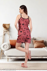 Pink satin nightdress set with height-adjustable straps, featuring digital heart print on Lycra fabric. Made in India